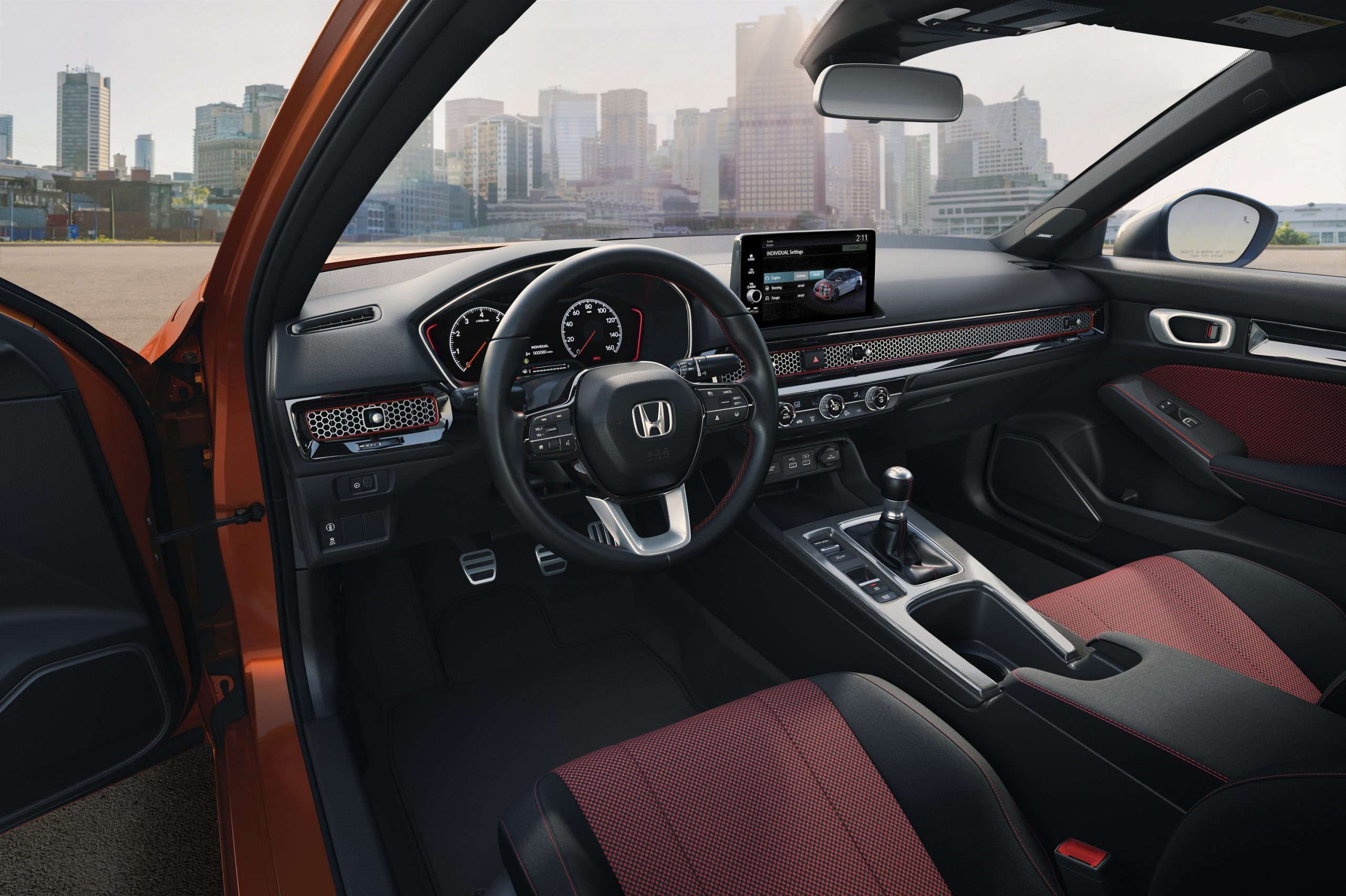 The red-accented of the new Civic Si with a manual transmission
