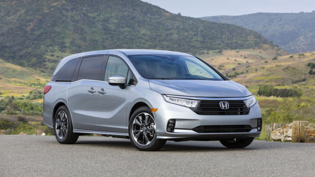 A silver 2022 Honda Odyssey parked outside during the day. The Honda Odyssey is one of the most popular minivans for 2021