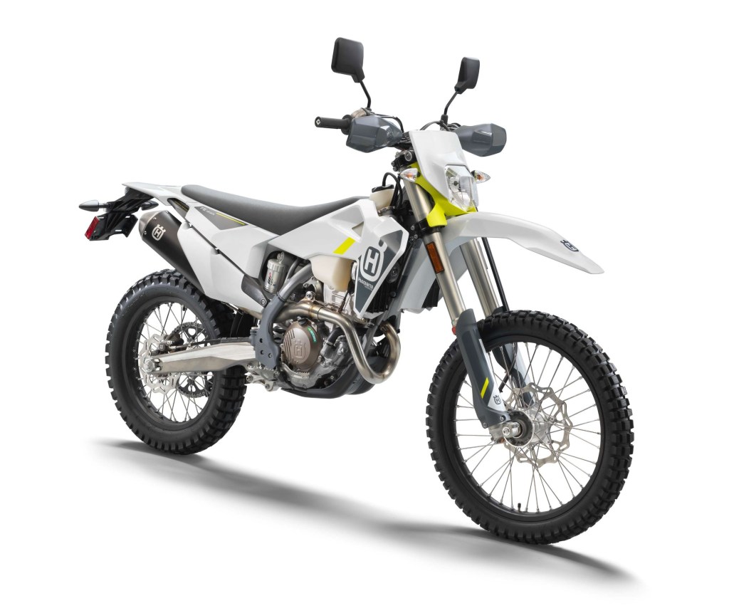 A white-blue-and-yellow 2022 Husqvarna FE 350s street-legal dual-sport dirt bike