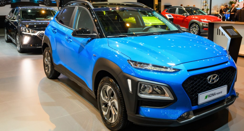 A blue Hyundai Kona is on display.
