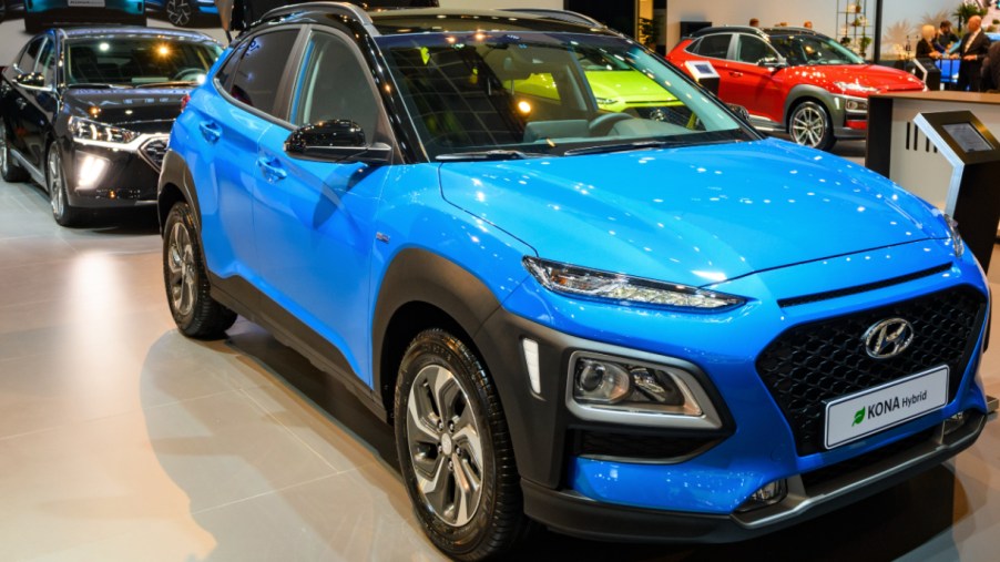 A blue Hyundai Kona is on display.