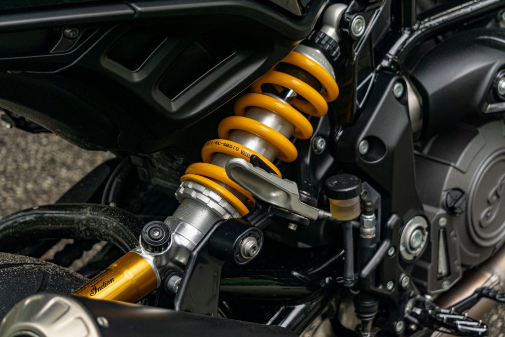A close-up view of the 2022 Indian FTR S's optional accessory gold Ohlins rear shock