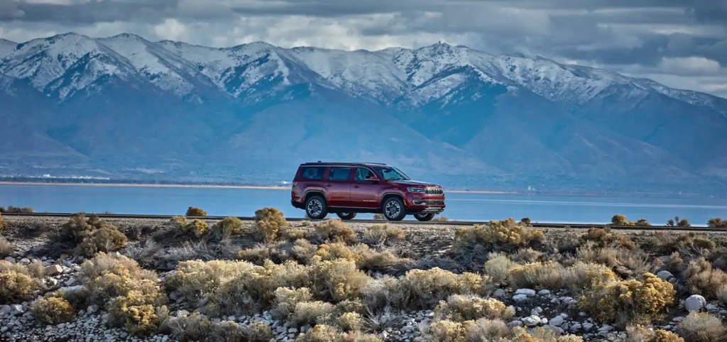 A 2022 Jeep Wagoneer parked with a mountain background