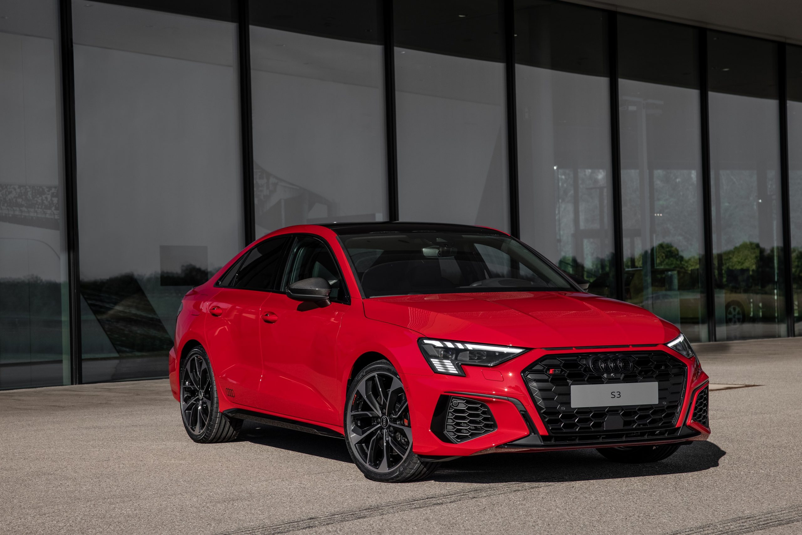 A red 2022 Audi S3 shot from the 3/4 angle