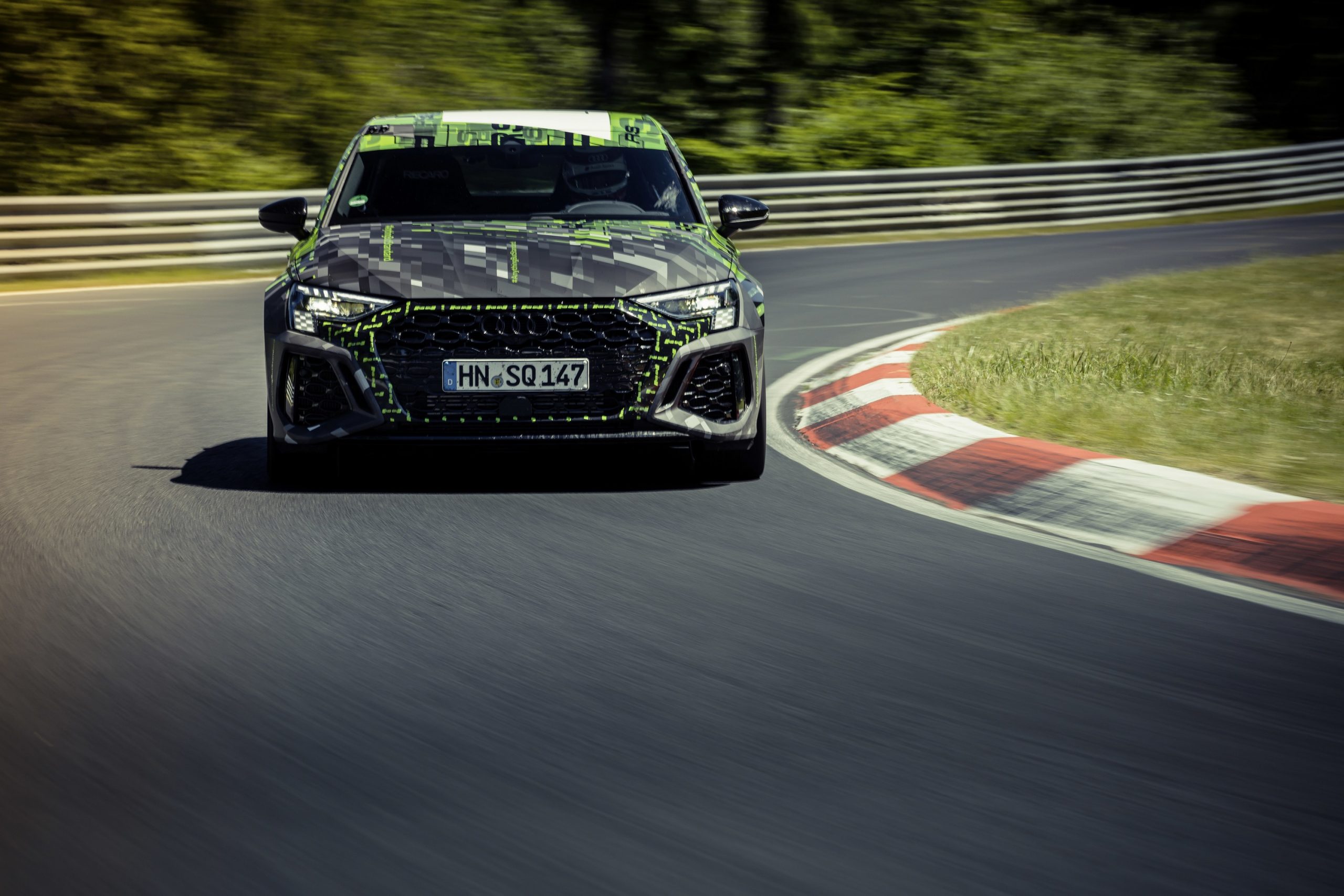 A camouflaged 2022 Audi RS3 shot from the front at the Nurburgring