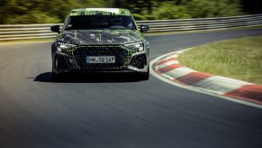 A camouflaged 2022 Audi RS3 shot from the front at the Nurburgring