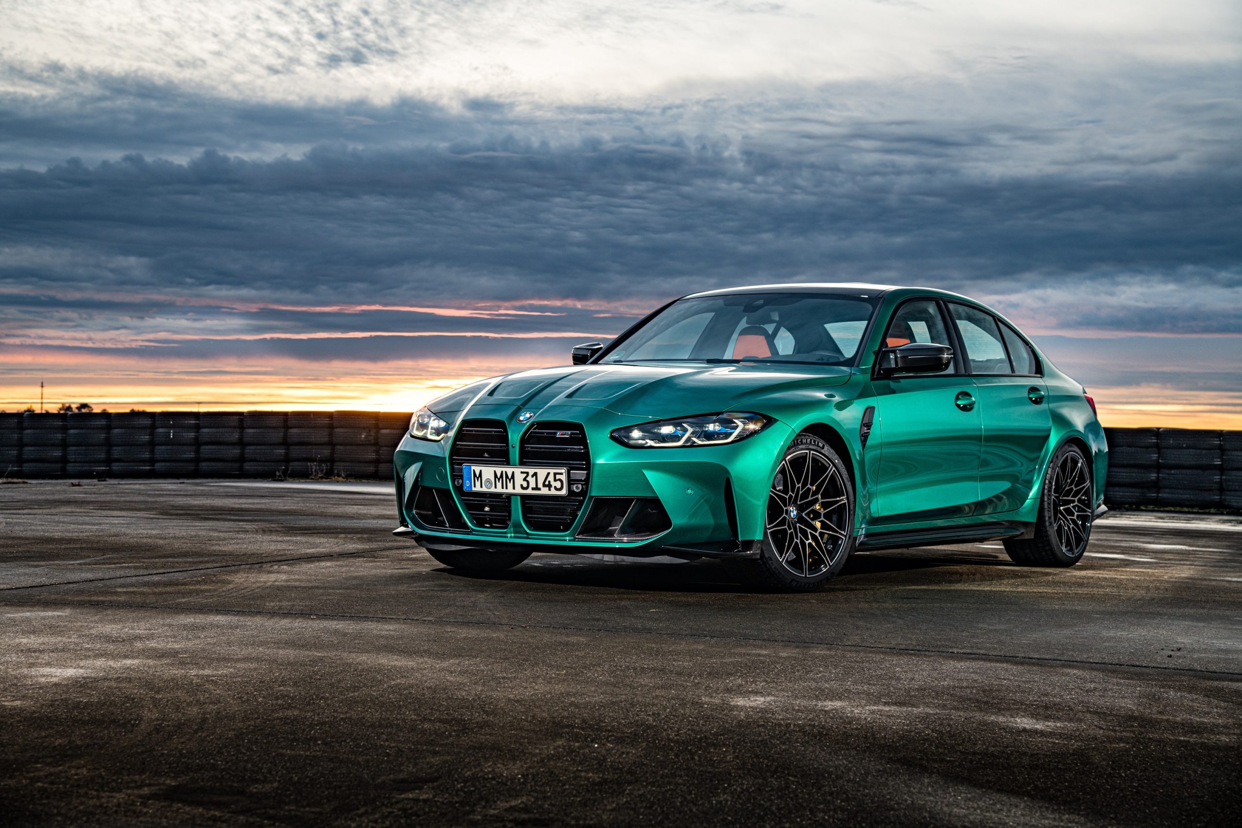 An Isle of Man green BMW M3 shot at sunset in profile