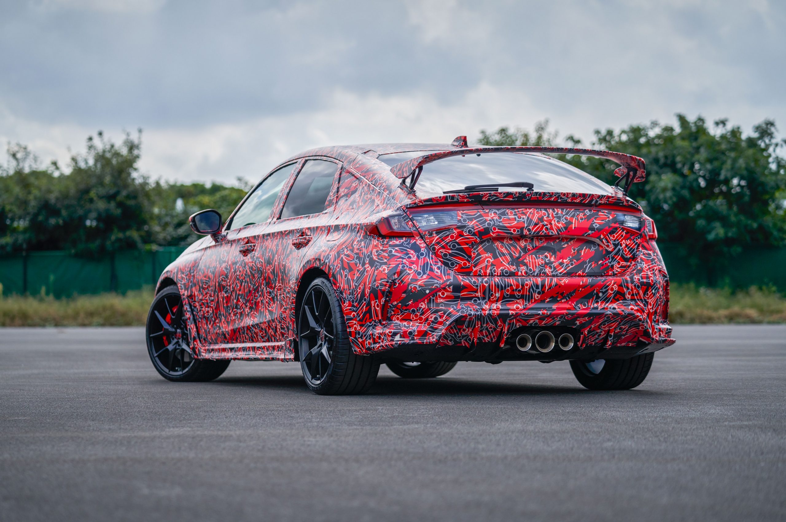 The rear of the 2022 Honda Civic Type R in camo livery shot from the rear 3/4