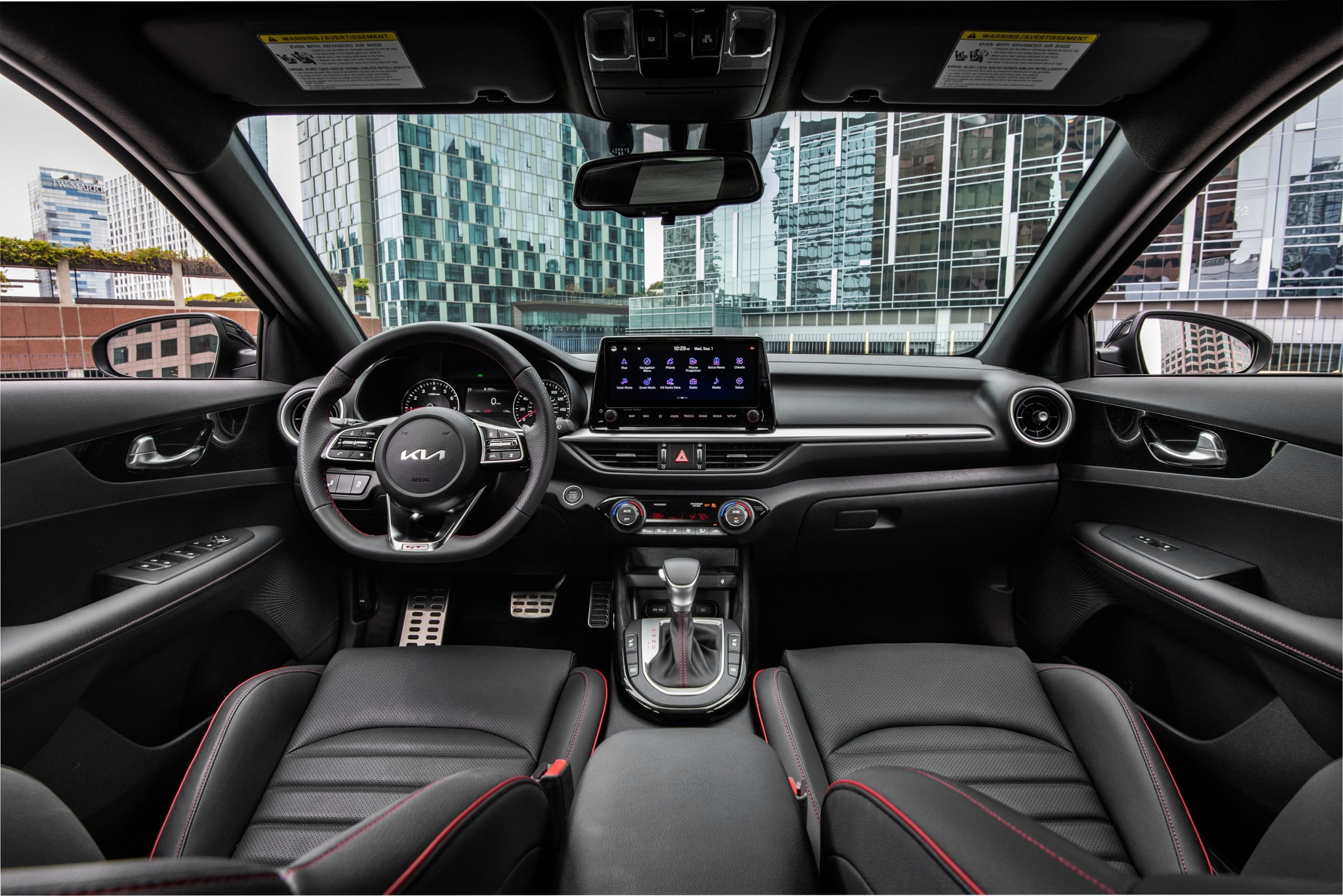 The interior of the new Forte with black leather seats and contrast red stitching