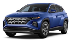 A blue 2022 Hyundai Tucson against a white background.