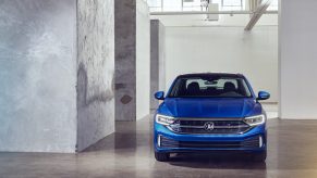 A blue 2022 Volkswagen Jetta shot from the front