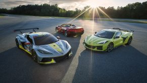 A trio of Chevrolet Corvette Z06 models, from the C8 R race car to the convertible, to the targa, shot at sunset