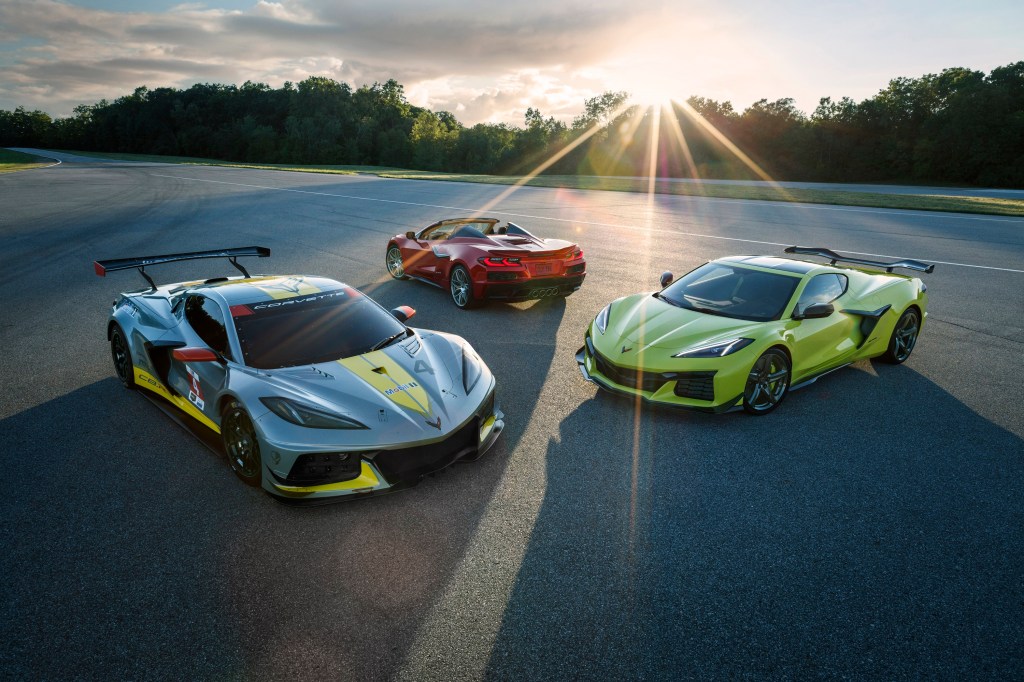 A trio of Chevrolet Corvette Z06 models, from the C8 R race car to the convertible, to the targa, shot at sunset