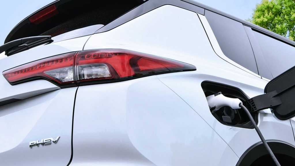 White 2023 Mitsubishi Outlander Plug-in hybrid plugged in
