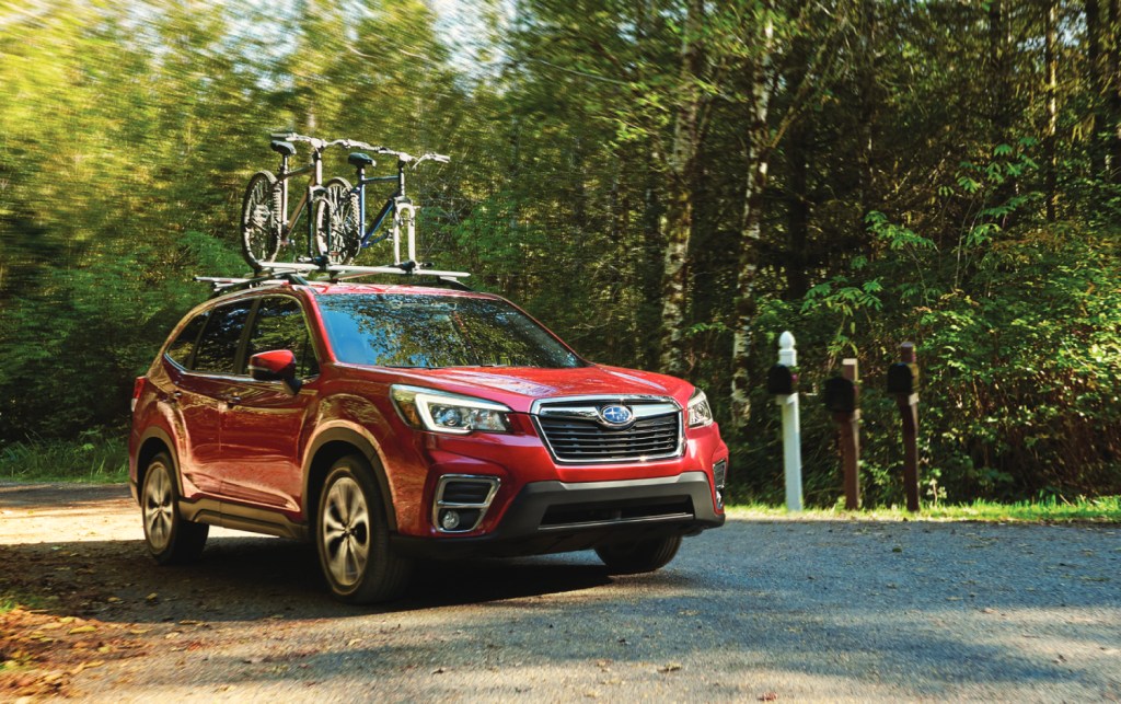 Red 2021 Subaru Forester with two bikes on top, the Forester is one of the best SUVs under $30,000