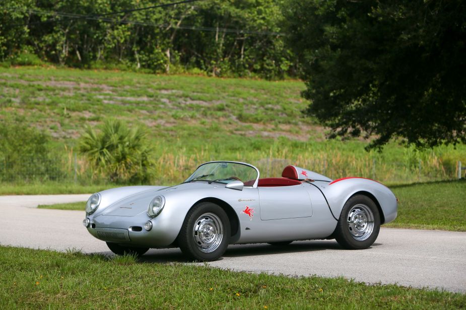 A silver-with-red-badging Beck 550 Spyder Replica by Chamonix Karosserie on a country road