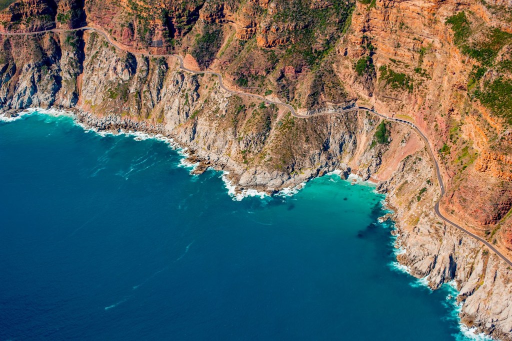 Aerial view of the coastline of Hout Bay and Chapman’s Peak Drive, South Africa
