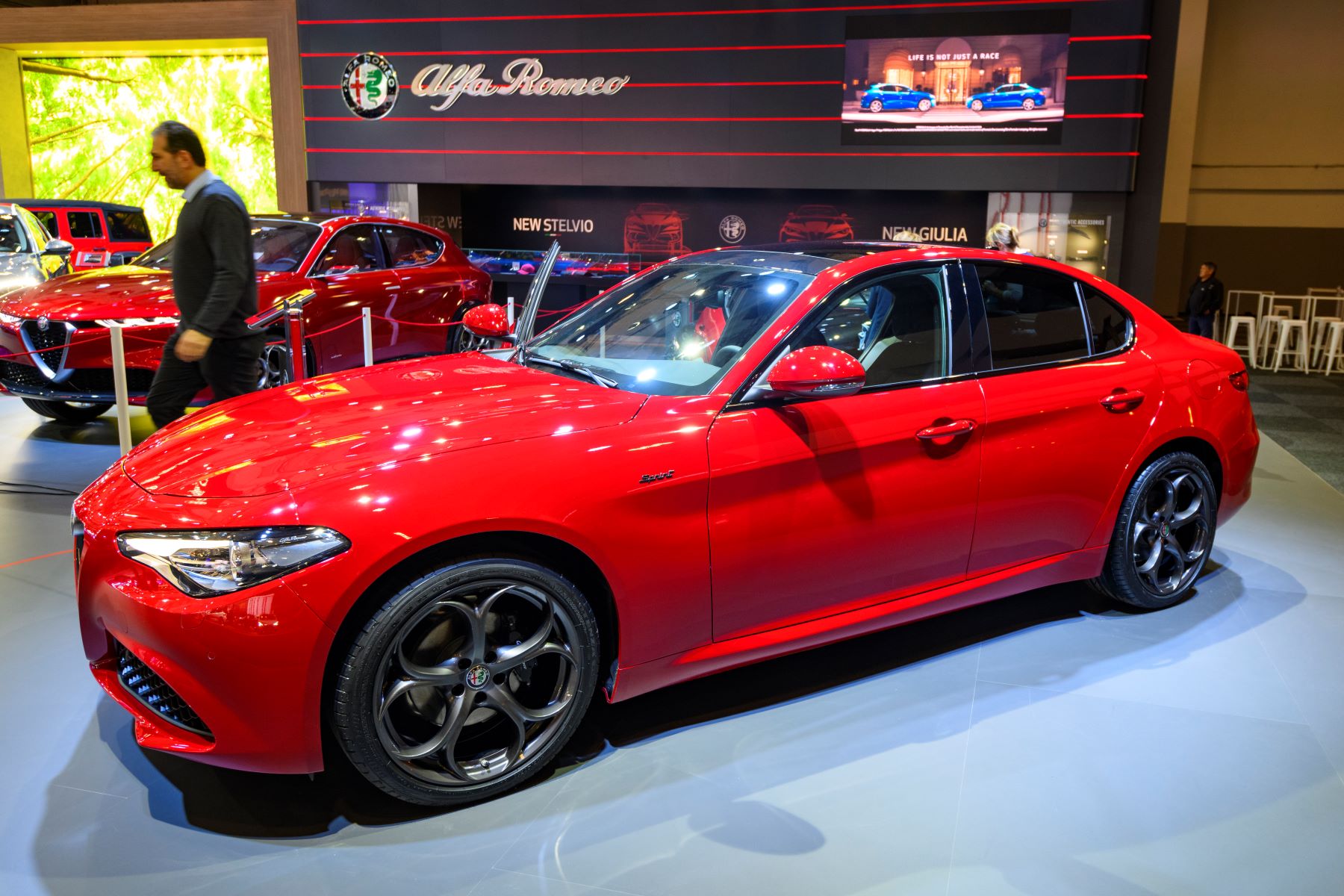 The Alfa Romeo Giulia luxury sports sedan in red at the Brussels Expo in Belgium