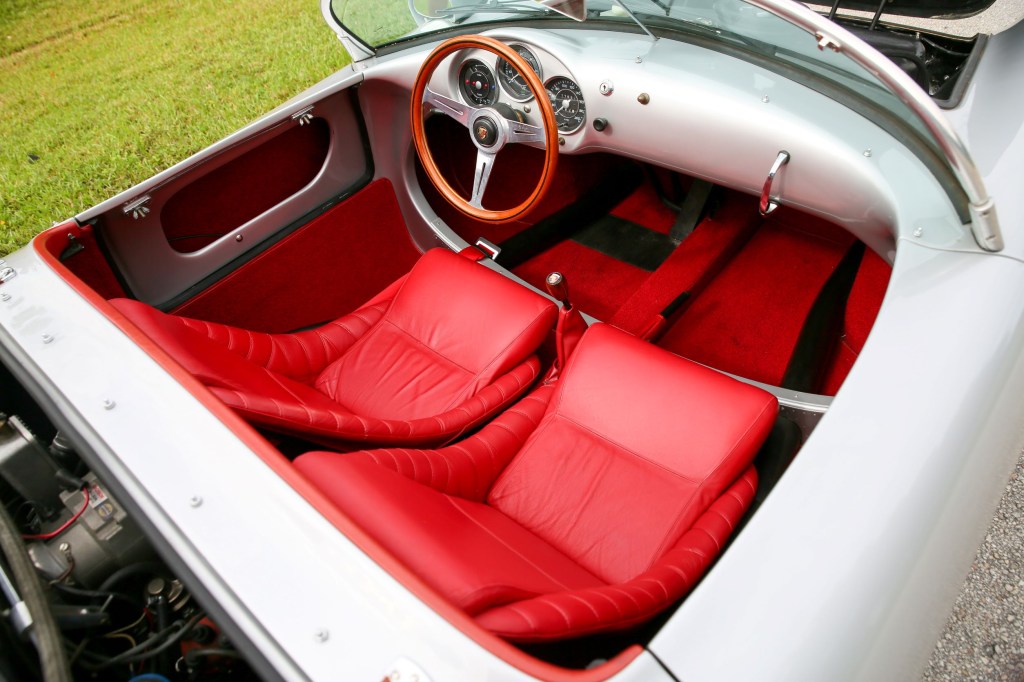 The red-leather seats and silver dashboard of a silver Beck 550 Spyder Replica by Chamonix Karosserie