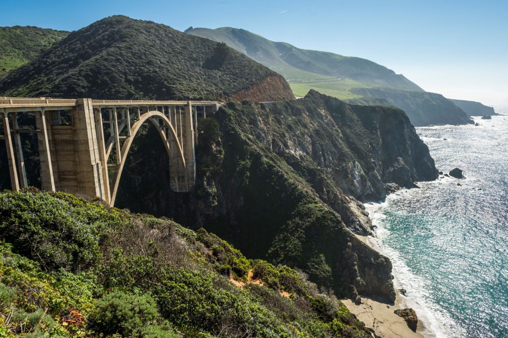 Bixby Bridge on the Pacific Coast Highway, mountains, vegetation, and coastline in Big Sur, California
