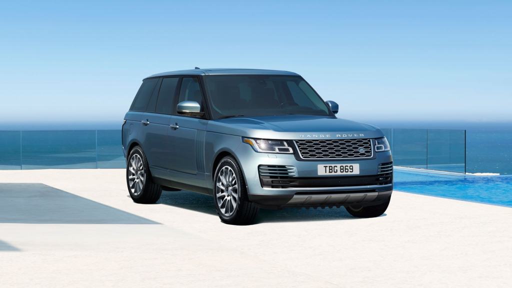 Blue 2022 Land Rover Range Rover parked next to an infinity swimming pool