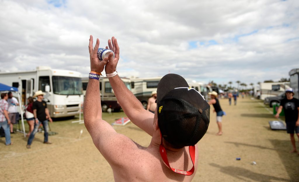 Music fans play drinking games in the RV park during the 2016 Stagecoach California Country Music Festival at the Empire Polo Club.