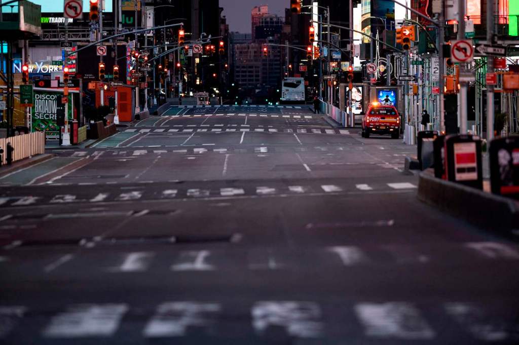 This is a photo of a deserted, early-morning Times Square. Cannonball motorcycle record attempts begin in NYC, often before dawn | JOHANNES EISELE/AFP via Getty Images