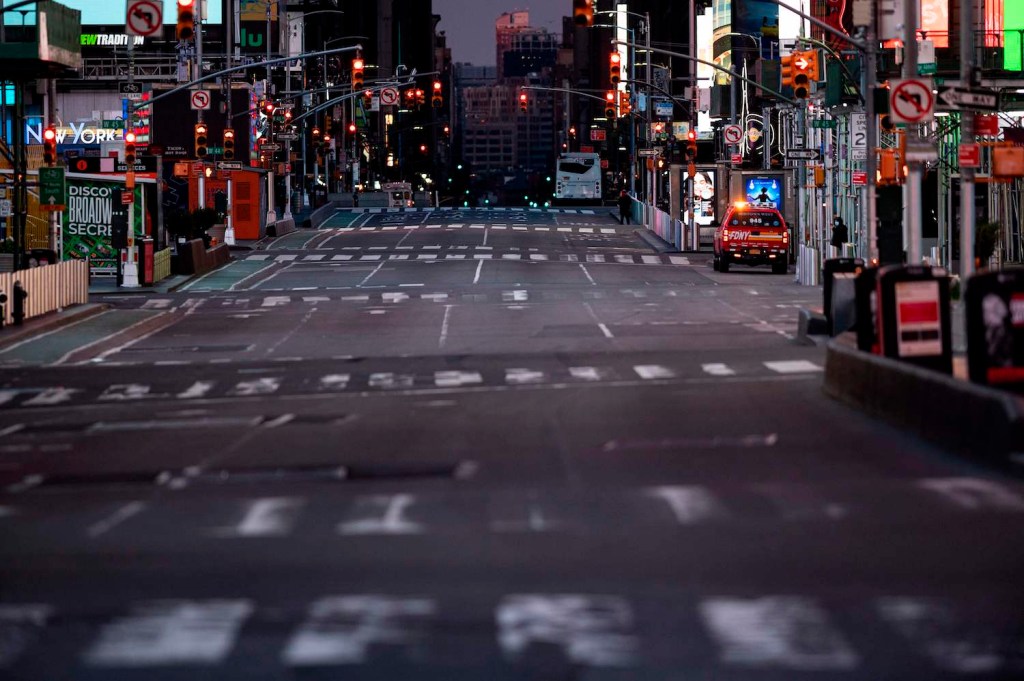 This is a photo of a deserted, early-morning Times Square. Cannonball motorcycle record attempts begin in NYC, often before dawn | JOHANNES EISELE/AFP via Getty Images