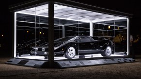 The 1979 Lamborghini Countach from the film "The Cannonball Run" on display at the National Mall at night in a special glass display case to celebrate its inclusion in the National Historic Vehicle Register