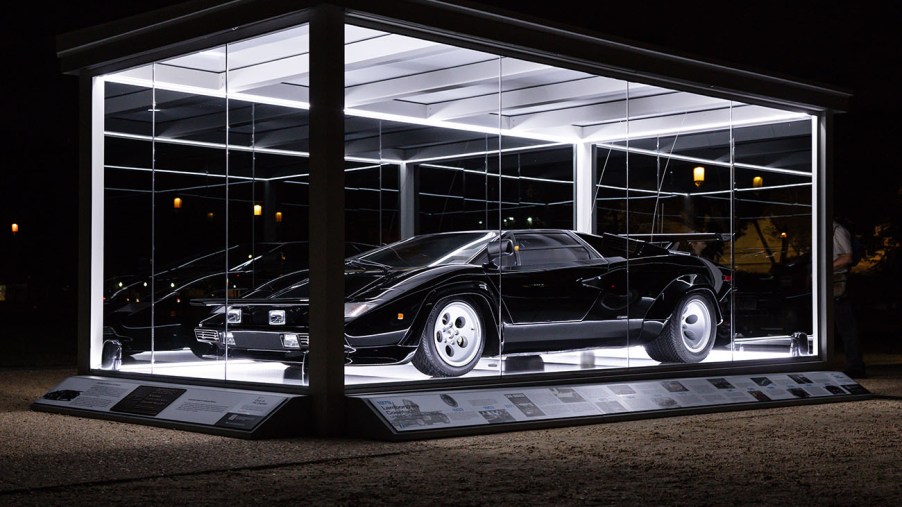The 1979 Lamborghini Countach from the film "The Cannonball Run" on display at the National Mall at night in a special glass display case to celebrate its inclusion in the National Historic Vehicle Register