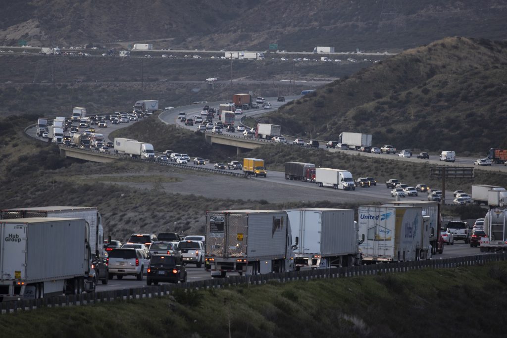 Cars And Semi Trucks Stuck In Highway Traffic