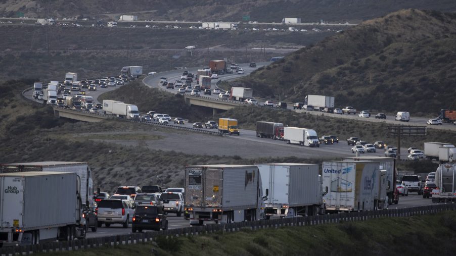 Cars And Semi Trucks Stuck In Highway Traffic