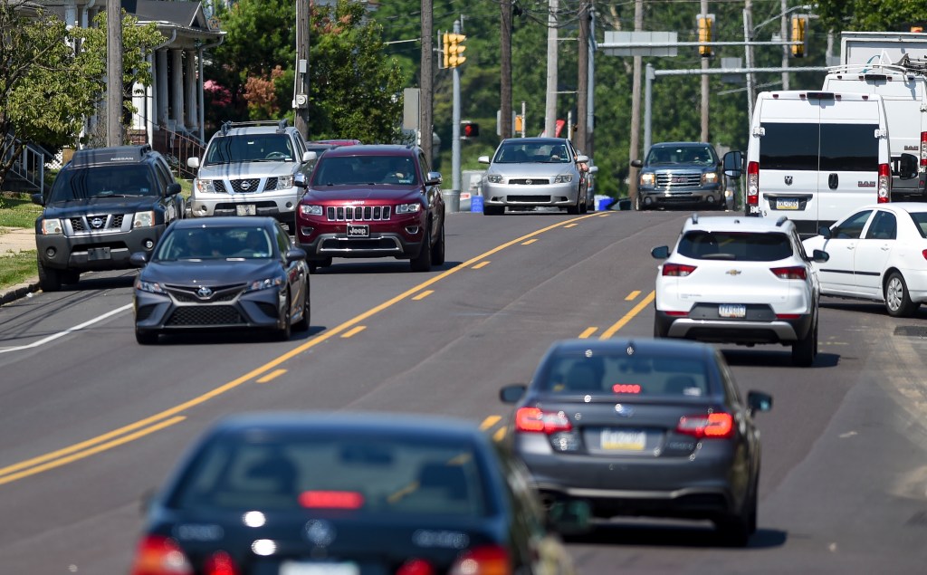 Cars Driving In Traffic On City Street