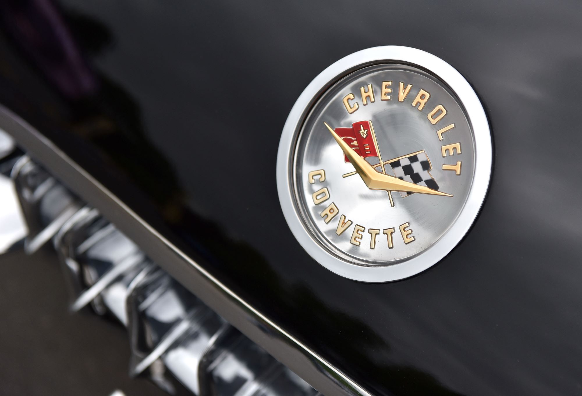 Chevrolet Corvette logo on a black car.
