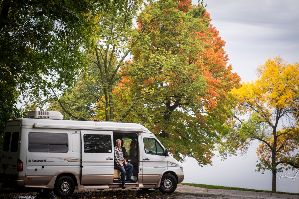 Class B Camper Van Parked In Woods.  What's the average cost of a camper van like this one. 