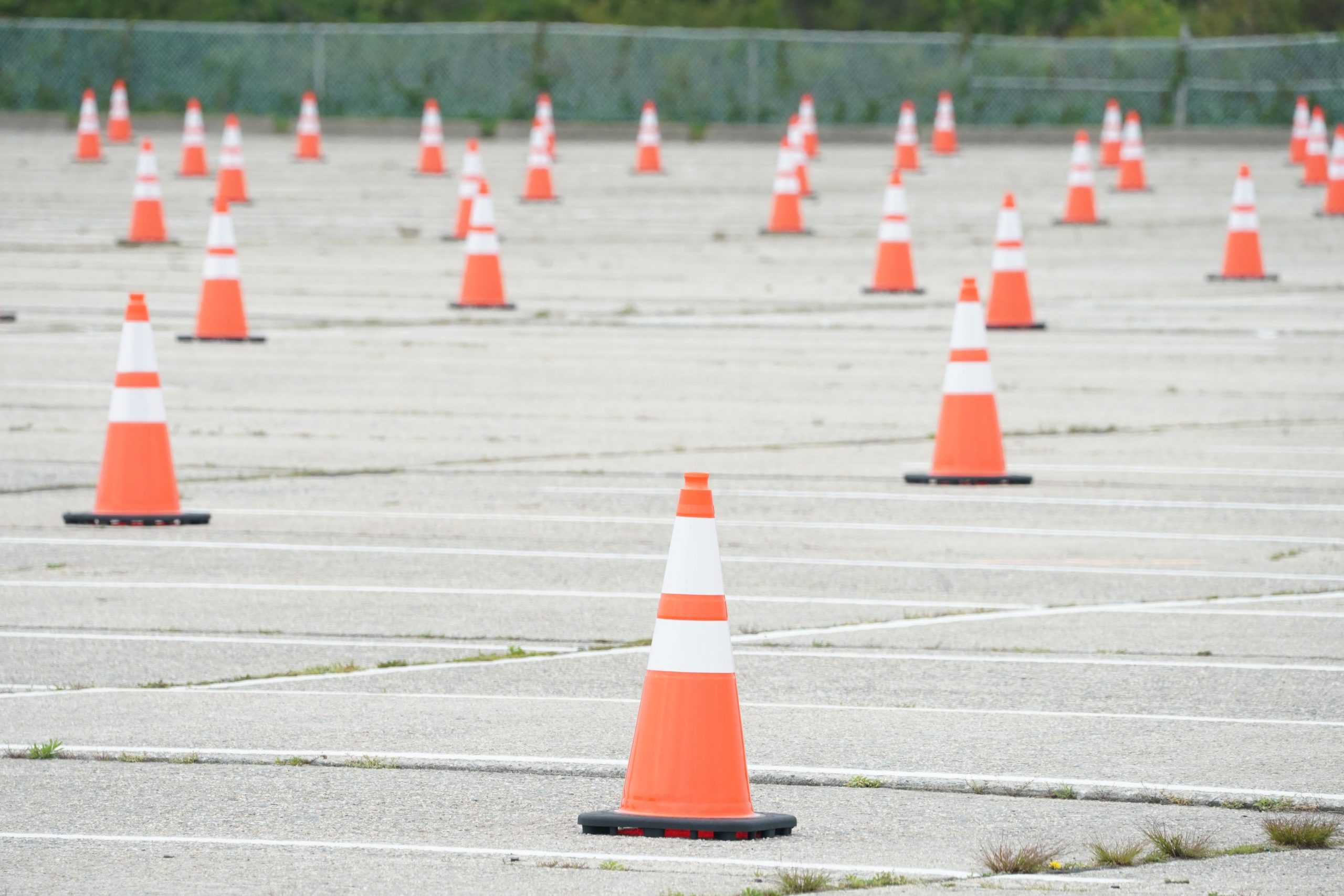 Cones Scattered Throughout Empty Parking Lot