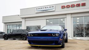 A Dodge Challenger outside of a Chrysler Dodge Jeep Ram FCA dealership in Gurnee, Illinois