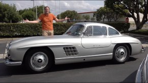 Doug DeMuro with a silver 1954 Mercedes 300SL Gullwing coupe