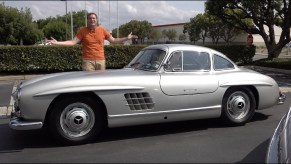 Doug DeMuro with a silver 1954 Mercedes 300SL Gullwing coupe