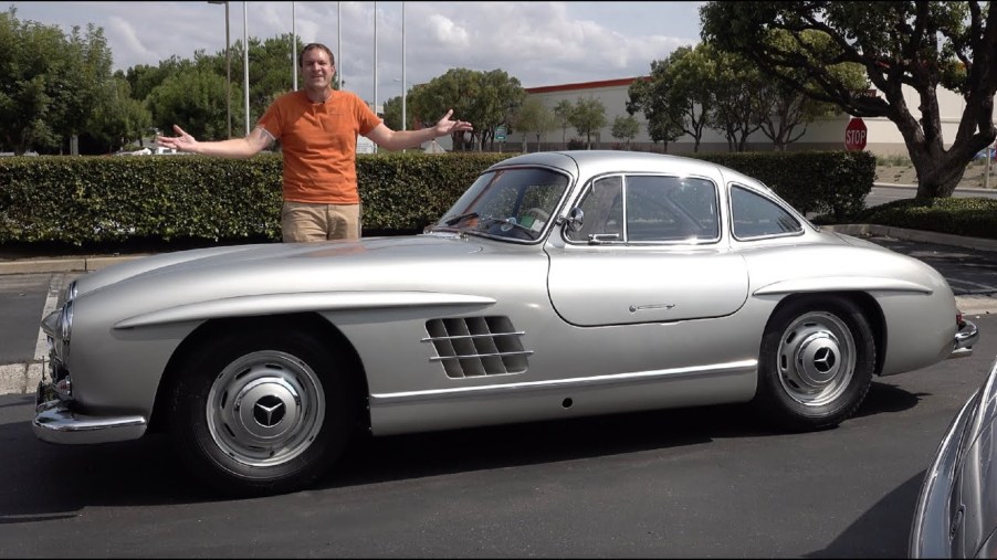 Doug DeMuro with a silver 1954 Mercedes 300SL Gullwing coupe