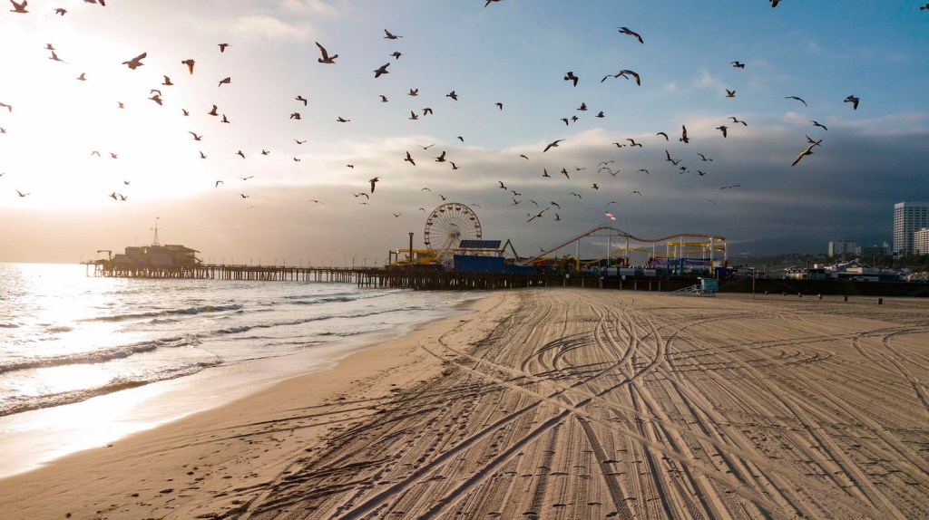 This is a photo of Los Angeles where the Cannonball record runs end. The current electric vehicle record is less than two days, coast-to-coast. | ROBYN BECK/AFP via Getty Images