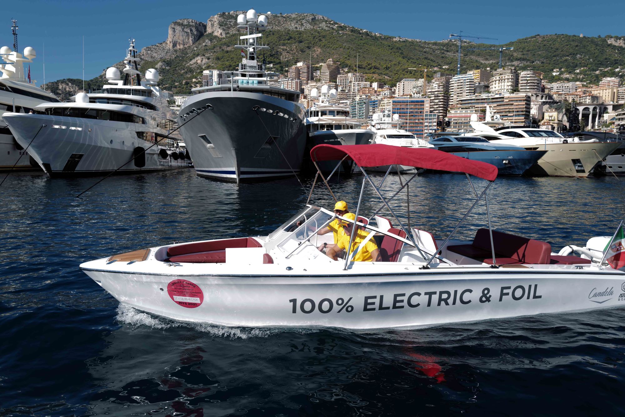 A boat with Electric on the side on the water.