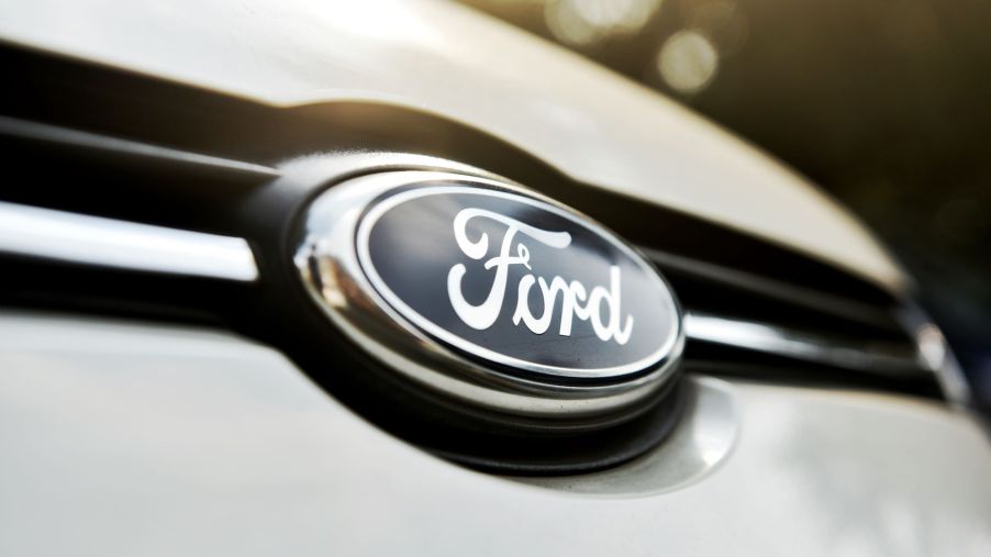 A Ford logo, where David Fields now works, on the front of a white vehicle.