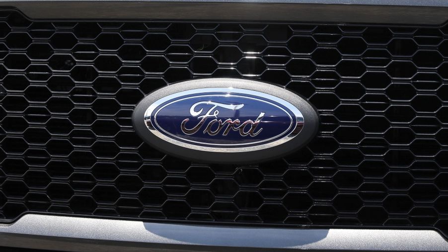 A Ford logo on a grill like what can be found on a Ford truck.