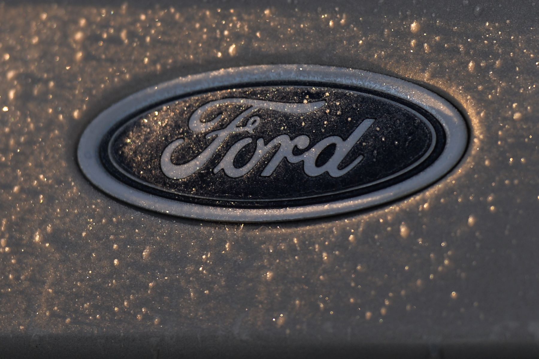 The Ford logo on a parked car in Dublin, Ireland