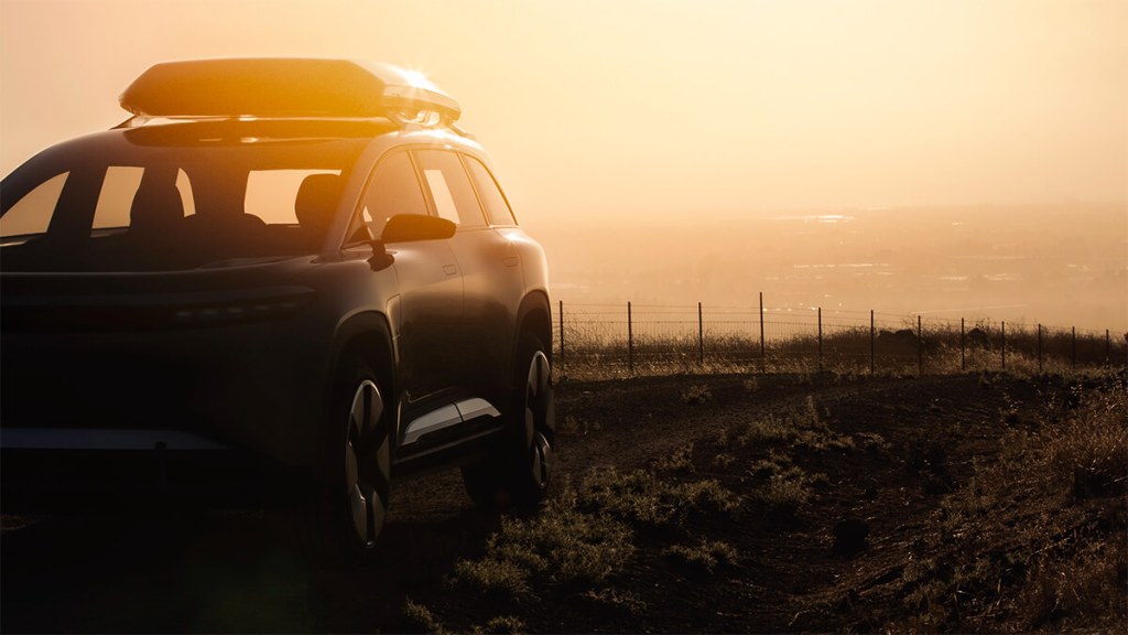 Front view of Lucid Gravity electric crossover SUV with the sunset in the background