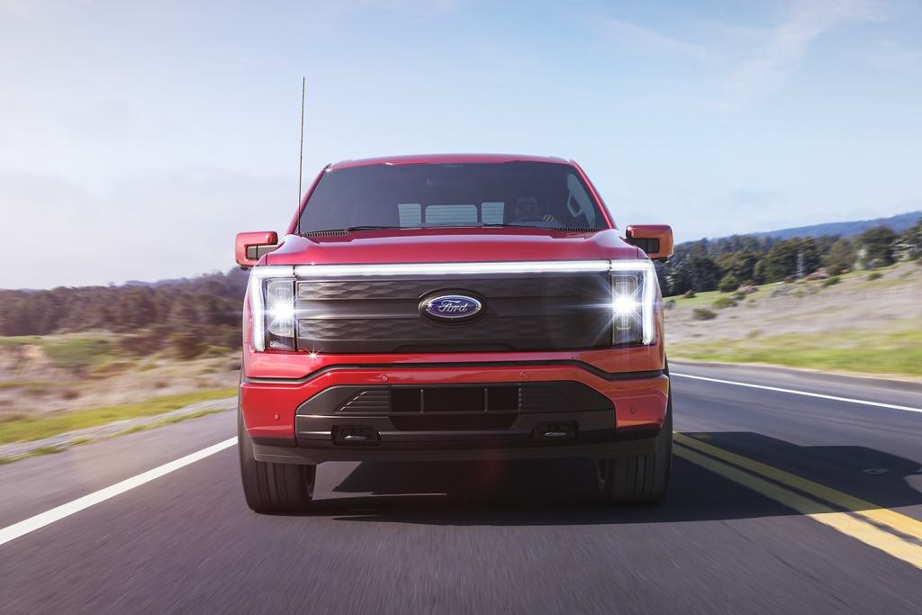 Front view of red 2022 Ford F-150 Lightning electric pickup truck.