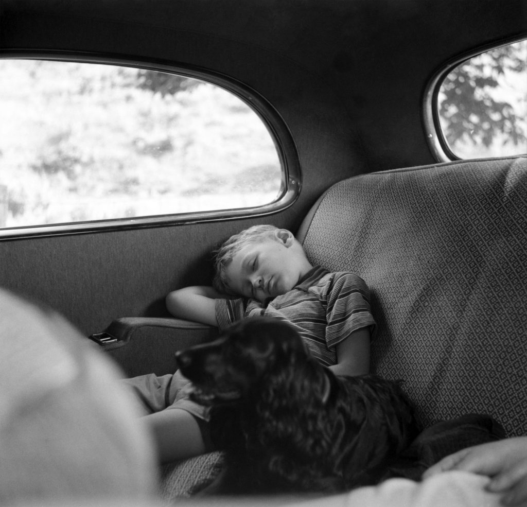 A kid napping in a car. Sleeping in a car comfortably, overnight, often comes down to airflow and temperature. | Montifraulo Collection/Getty Images