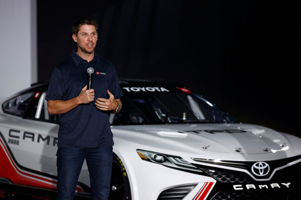 NASCAR driver Denny Hamlin unveiling the Next Gen Toyota. This is our ultimate guide to the 725 horsepower engine, downforce improving aerodynamics, and transaxle transmission of the NASCAR Next Generation car. | Jared C. Tilton/Getty Images
