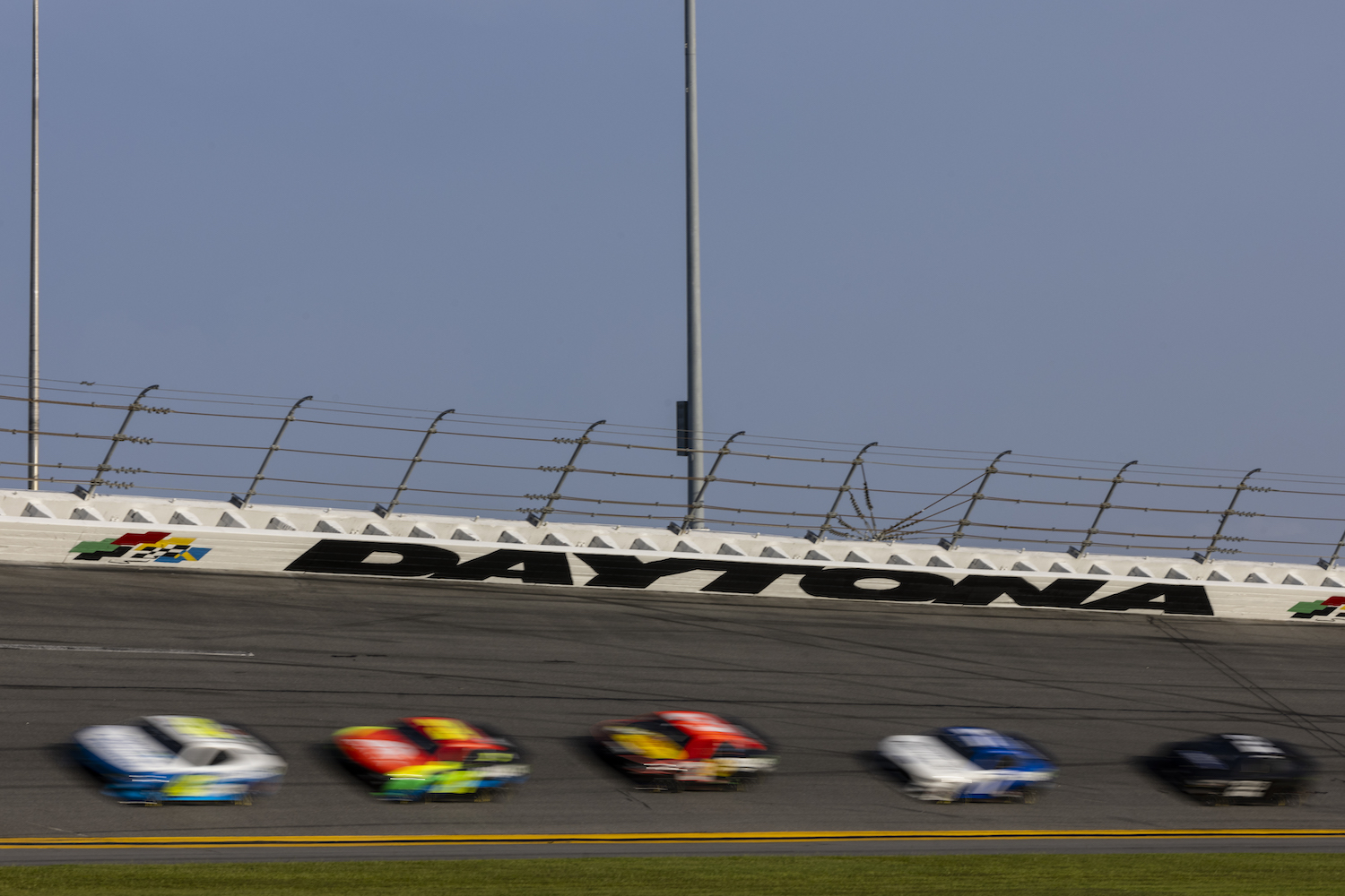 This is a pack of NASCAR Next Generation Cars participating in the drafting test at the Daytona International Speedway. Nascar Tries To Keep Drivers From Cooking Like ‘Turkeys’ Inside the Next Gen Race Car. | James Gilbert/Getty Images